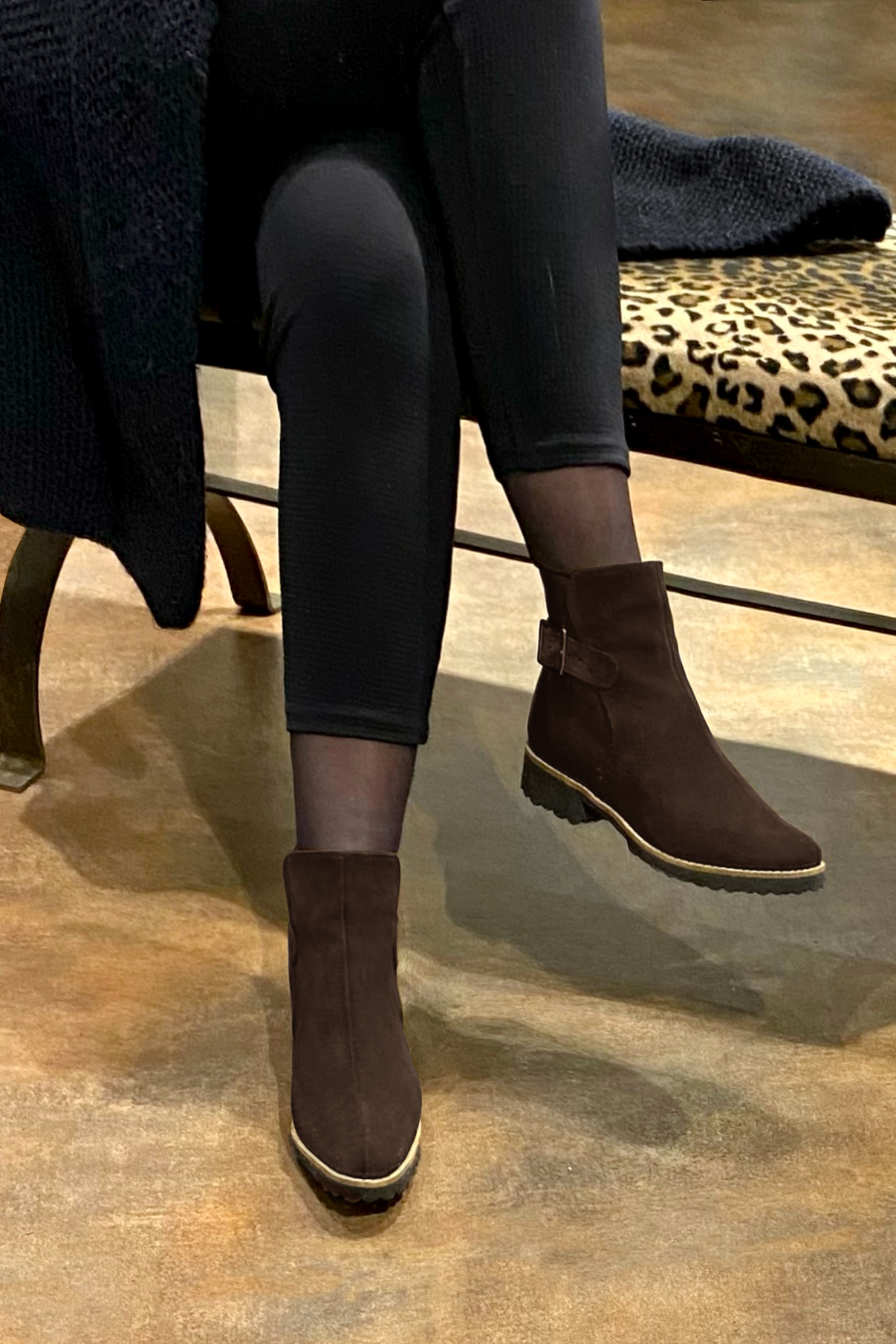 Dark brown women's ankle boots with buckles at the back. Round toe. Flat rubber soles. Worn view - Florence KOOIJMAN